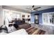 Open-concept living room featuring modern furniture, a cozy rug, and a view of the dining and kitchen areas at 2628 Lamar Dr, Whitestown, IN 46075