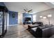 Cozy living room with a large television, modern decor, and a ceiling fan for added comfort at 2628 Lamar Dr, Whitestown, IN 46075