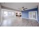 Open concept living room with kitchen view, wood floors, and lots of natural light at 2628 Lamar Dr, Whitestown, IN 46075