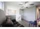 Inviting loft area featuring a comfortable leather sofa, fun arcade game, and new ceiling fan at 2628 Lamar Dr, Whitestown, IN 46075