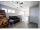 Inviting loft area featuring a comfortable leather sofa, fun arcade game, and natural light at 2628 Lamar Dr, Whitestown, IN 46075