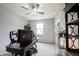 Bright office with a ceiling fan, a large monitor, and white walls at 2628 Lamar Dr, Whitestown, IN 46075