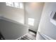 Bright stairway, well lit with white walls, railing, and new wooden steps at 2628 Lamar Dr, Whitestown, IN 46075
