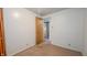 Bedroom with carpeted flooring and door leading to another room at 268 S Grant Ave, Indianapolis, IN 46201