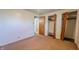 Bedroom with a closet, showing doorway to another room, and carpet flooring at 268 S Grant Ave, Indianapolis, IN 46201