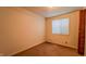 Bedroom featuring neutral walls, carpet, and closet doors at 268 S Grant Ave, Indianapolis, IN 46201