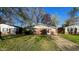 Charming single-story home with brick facade and well-manicured lawn at 268 S Grant Ave, Indianapolis, IN 46201
