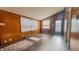 Bright room with vintage wood paneled walls, and sunlight shining through windows at 268 S Grant Ave, Indianapolis, IN 46201