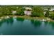 Scenic aerial view of waterfront homes with private docks on a tranquil lake setting surrounded by lush trees at 2823 Somerset Bay, Indianapolis, IN 46240