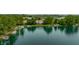 Breathtaking aerial perspective of a serene lake, surrounded by lush greenery and charming waterfront homes with docks at 2823 Somerset Bay, Indianapolis, IN 46240