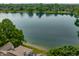 Picturesque aerial view of a tranquil lake with waterfront properties, showcasing the scenic beauty of the community at 2823 Somerset Bay, Indianapolis, IN 46240