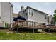 Charming back deck area with patio furniture and gray siding, perfect for outdoor relaxation and entertaining at 2823 Somerset Bay, Indianapolis, IN 46240