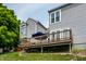 Cozy back deck with an umbrella for shade and gray siding, offering a peaceful outdoor retreat at 2823 Somerset Bay, Indianapolis, IN 46240