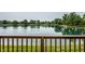 Scenic backyard view, deck overlooking tranquil lake, creating serene escape with scenic waterfront views at 2823 Somerset Bay, Indianapolis, IN 46240