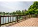 Peaceful backyard deck overlooking tranquil lake, blending relaxation with beautiful waterfront views at 2823 Somerset Bay, Indianapolis, IN 46240