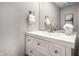 Bathroom featuring white vanity with drawers, a faucet, large mirror and neutral walls at 2823 Somerset Bay, Indianapolis, IN 46240