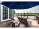 Beautiful backyard deck with lounge chairs offering stunning lake views; perfect for outdoor relaxation and enjoyment at 2823 Somerset Bay, Indianapolis, IN 46240