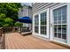 Inviting backyard wooden deck with lounge chairs and patio umbrella; the perfect spot to enjoy the outdoors at 2823 Somerset Bay, Indianapolis, IN 46240