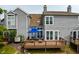 Attractive gray-sided home with a cozy back deck and patio furniture, perfect for enjoying outdoor living at 2823 Somerset Bay, Indianapolis, IN 46240