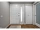 Bright foyer featuring clean, white doors, grey walls, and stunning hardwood floors at 2823 Somerset Bay, Indianapolis, IN 46240