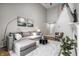 Bright living room featuring stairs, high ceilings, fireplace and a comfortable grey sofa at 2823 Somerset Bay, Indianapolis, IN 46240