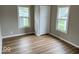 Bedroom with wood-look flooring and a closet, offering ample storage at 2924 Main St, Anderson, IN 46016