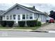 Charming home featuring large windows, a cozy front porch, and neat landscaping at 2924 Main St, Anderson, IN 46016