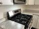 Stainless steel gas range cooktop against subway tile backsplash and custom cabinets at 2924 Main St, Anderson, IN 46016