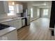 Well-lit kitchen flowing into an open-concept living space with modern appliances at 2924 Main St, Anderson, IN 46016