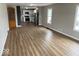 Open concept living space with modern flooring and a view of the kitchen at 2924 Main St, Anderson, IN 46016