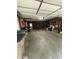 Spacious garage offering ample storage and workspace with concrete flooring and overhead lighting at 2935 Flintwood Dr, Columbus, IN 47203