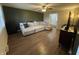 Inviting living room features a large sectional, ceiling fan, and wood-look floors at 2935 Flintwood Dr, Columbus, IN 47203