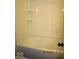 Bathroom featuring a white shower-tub combination with built in shelves at 3008 W Grace Ln, Muncie, IN 47304