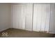 Bedroom with two double-door closets, providing ample storage space at 3008 W Grace Ln, Muncie, IN 47304