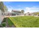 Spacious backyard with lawn, home, patio, and sunroom at 315 W High St, Pendleton, IN 46064