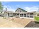 Spacious backyard featuring a brick patio and enclosed sunroom at 315 W High St, Pendleton, IN 46064