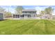 Backyard with sunroom, home, and white picket fence at 315 W High St, Pendleton, IN 46064