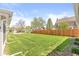 Large backyard with a well-maintained lawn and privacy fence at 315 W High St, Pendleton, IN 46064