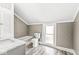 Bright bathroom featuring a tub, toilet, vanity, and tiled floors, ideal for relaxation and functionality at 315 W High St, Pendleton, IN 46064