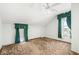 Bedroom with plush carpet, a ceiling fan, large window with green curtains, and bright natural light at 315 W High St, Pendleton, IN 46064