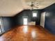 This bedroom includes hardwood floors, a ceiling fan, and natural light from the window at 315 W High St, Pendleton, IN 46064