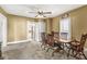 Dining room featuring a wooden table with chairs and carpet flooring, perfect for enjoying meals at 315 W High St, Pendleton, IN 46064