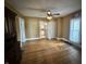 Hardwood floor dining room offers a view into kitchen at 315 W High St, Pendleton, IN 46064