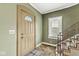 Inviting entryway with stairs, a window, and a classic front door, creating a welcoming first impression at 315 W High St, Pendleton, IN 46064
