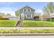 Charming two-story home features a well-manicured lawn and classic architectural details at 315 W High St, Pendleton, IN 46064