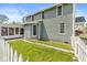 The exterior showcases a home with light green siding and a well-maintained lawn, providing a picturesque curb appeal at 315 W High St, Pendleton, IN 46064