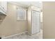 Hallway nook featuring a window, white trim, and a closet at 315 W High St, Pendleton, IN 46064