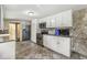 Full kitchen with tile floor, stainless steel appliances, and white cabinets at 315 W High St, Pendleton, IN 46064