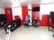 Finished basement area set up with an exercise area and entertainment center at 3426 Ireland Dr, Indianapolis, IN 46235