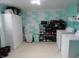 Spacious laundry room equipped with a washer, dryer, storage and laundry supplies at 3426 Ireland Dr, Indianapolis, IN 46235